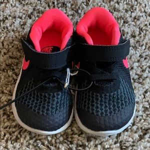 Black and hot pink Nike size 4c